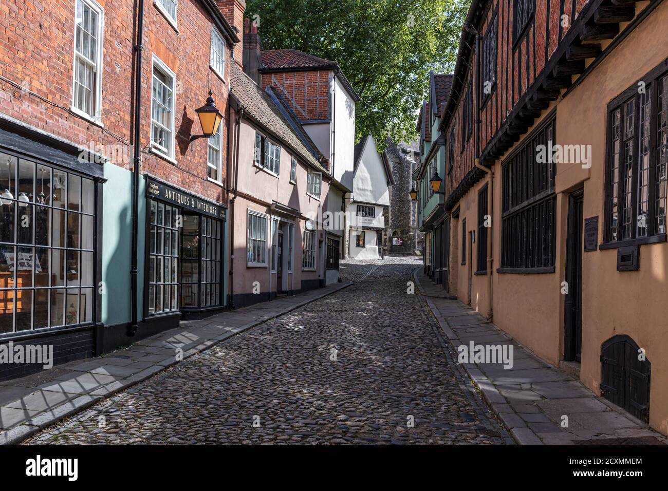 Historic Elm Hill in the old town, a cobbled lane with many buildings dating back to the Tudor period, Norwich, Norfolk, England, UK. Stock Photo