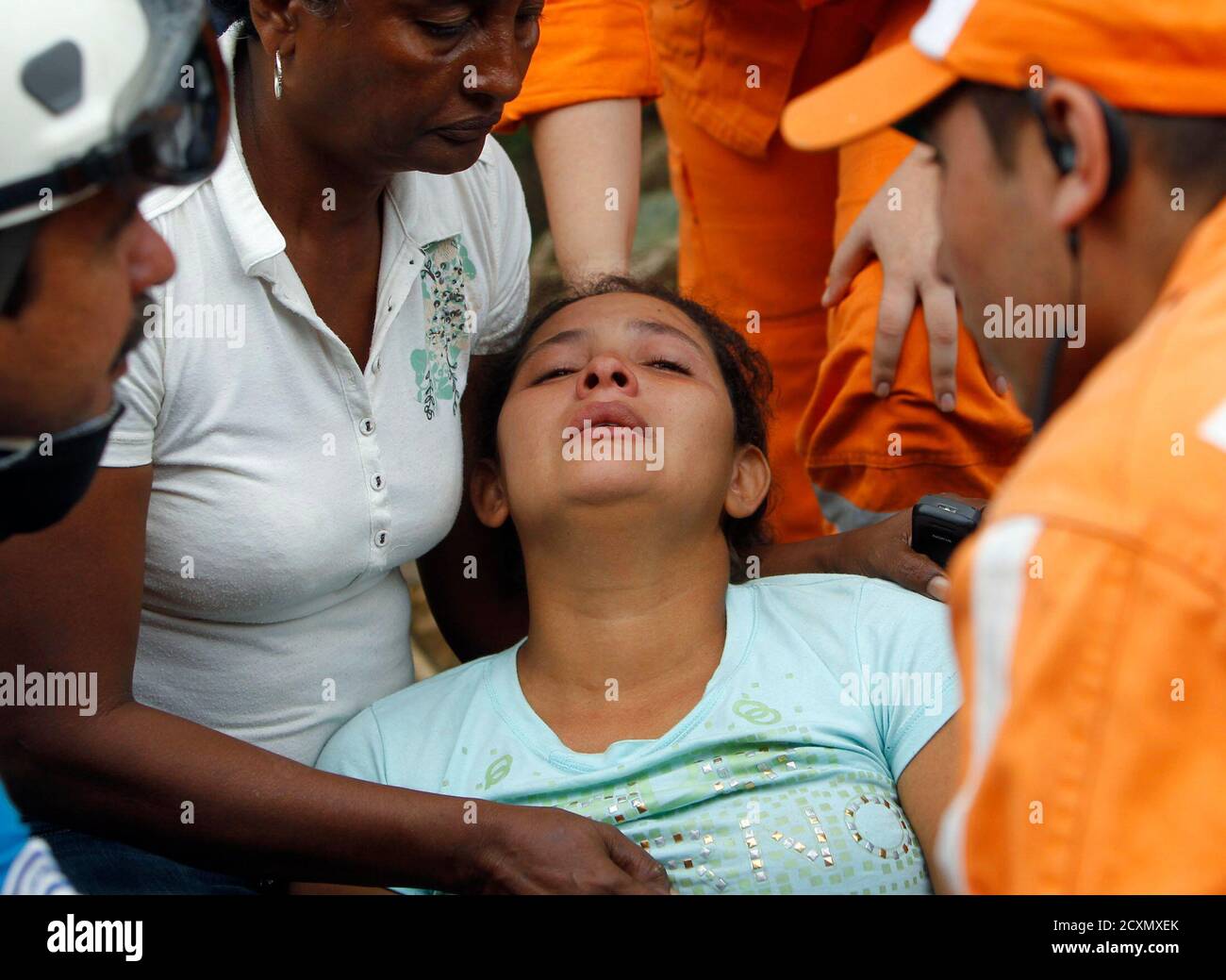Katerine Zapata, wife of miner Jorge lara, cries upon hearing news of his  death after an explosion at the coal mine "La Preciosa" in Norte de  Santander province, Sardinata January 26, 2011.