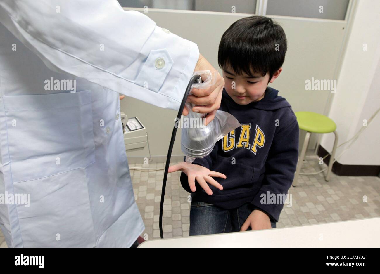 Yuya Sato From Soma In Fukushima Undergoes A Screening Test For Signs Of Nuclear Radiation By A Doctor At A Welfare Center In Yonezawa Northern Japan 98 Km 61 Miles From The