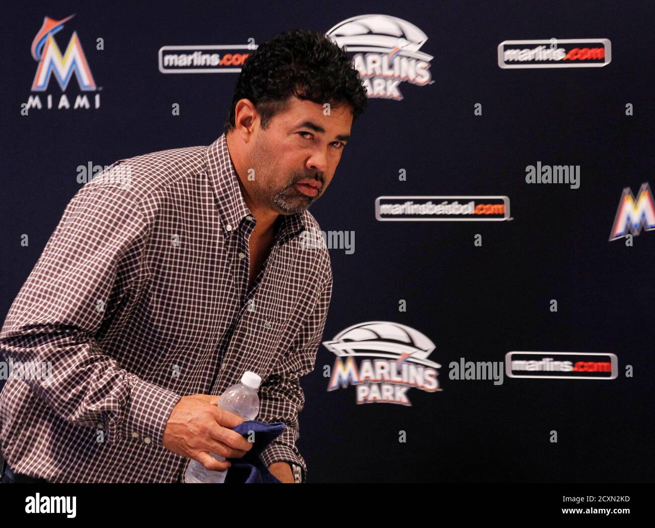 Miami Marlins manager Ozzie Guillen speaks at a news conference at Marlins Park in Miami, Florida April 10, 2012. The Miami Marlins baseball team suspended manager Ozzie Guillen for five games after he praised Cuba's Fidel Castro in a magazine interview. REUTERS/Joe Skipper (UNITED STATES  - Tags: SPORT BASEBALL) Stock Photo