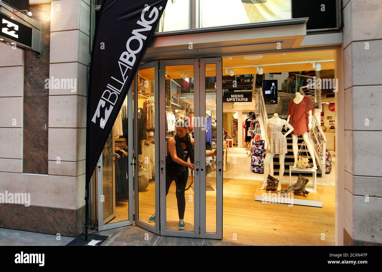 A Billabong employee opens the company store in central Sydney August 27,  2012. Australian surfwear company Billabong International outlined a  turnaround strategy to help it fend off a A$694 million ($723 million)