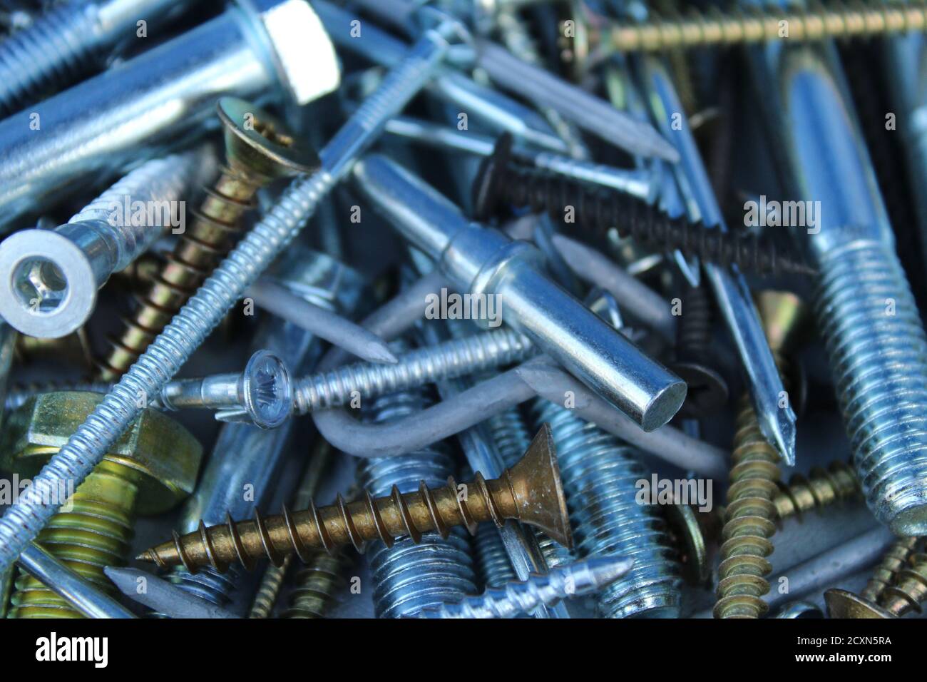 construction background bolts nuts screws nails silver white and yellow