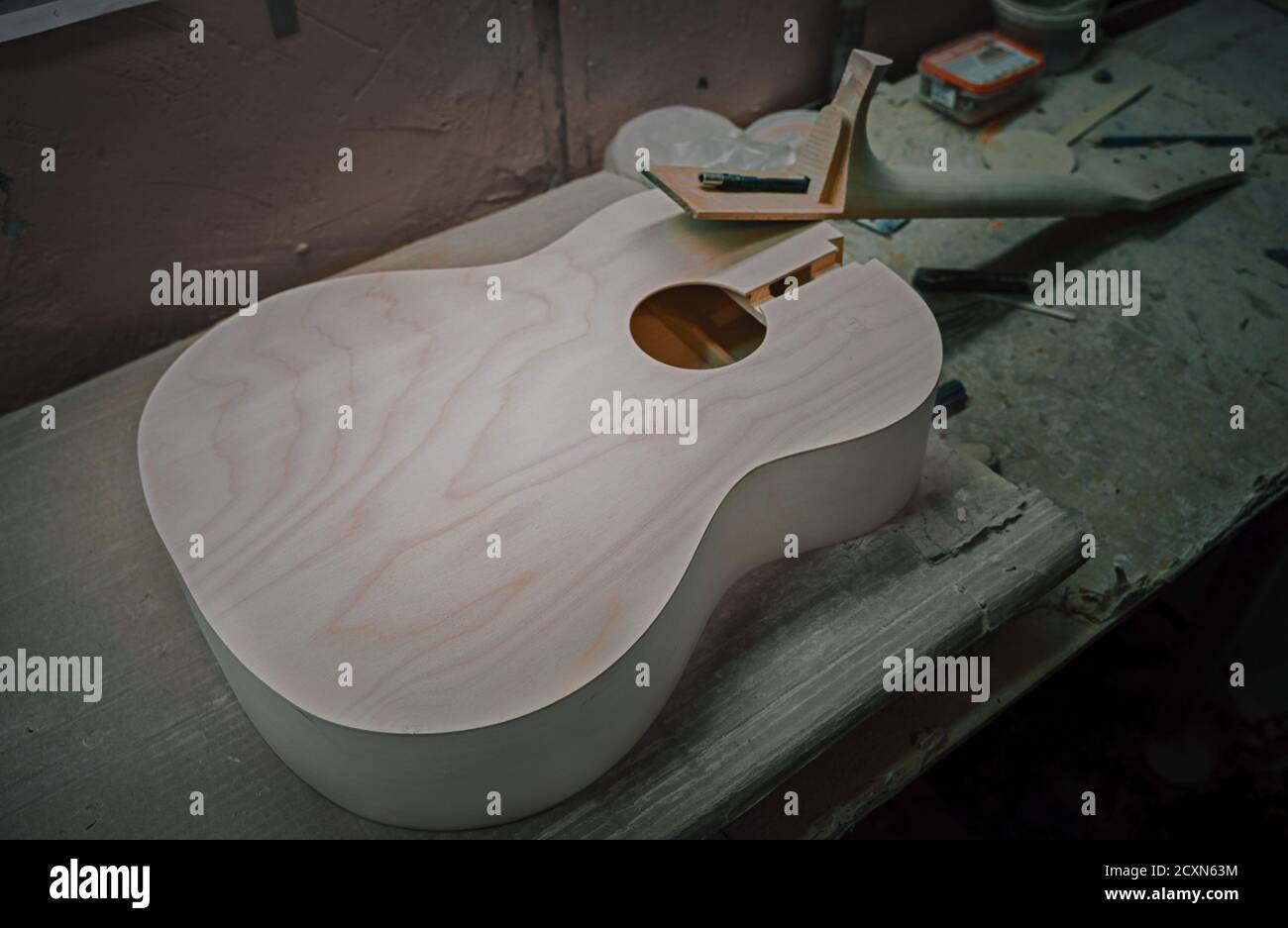 Unfinished acoustic guitar body wood with no components or finish at