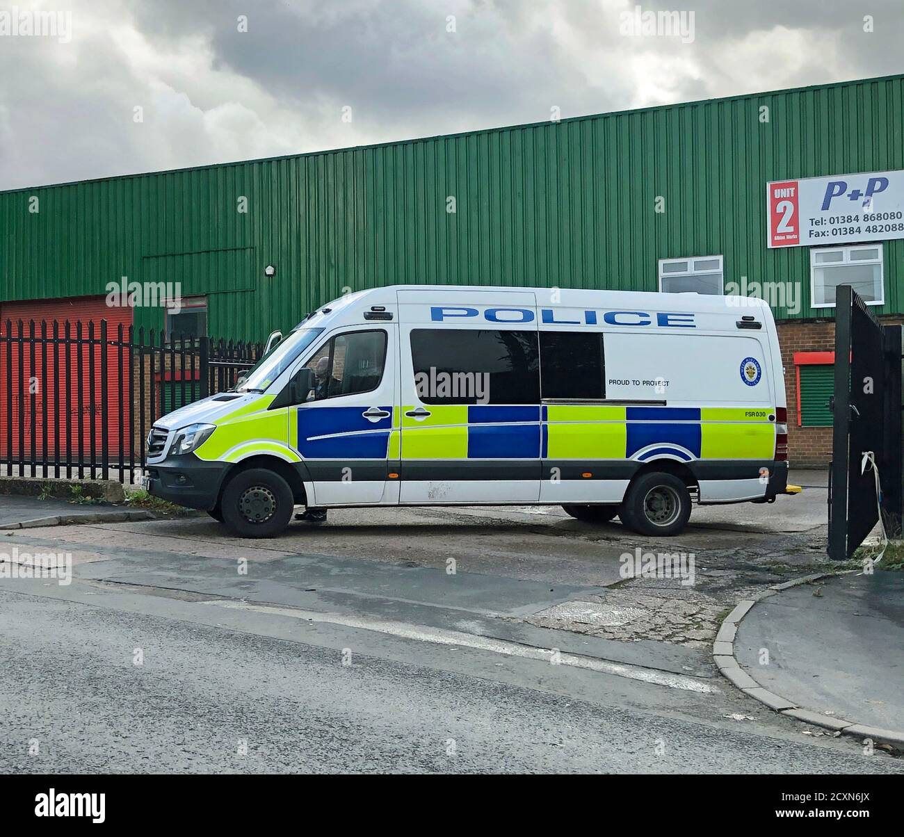A Police Vehicle Blocking An Entrance To Albion Works Industrial Estate In Brierley Hill West Midlands In The Area Where Two Men Were Found Shot Dead In A Car On Wednesday Afternoon