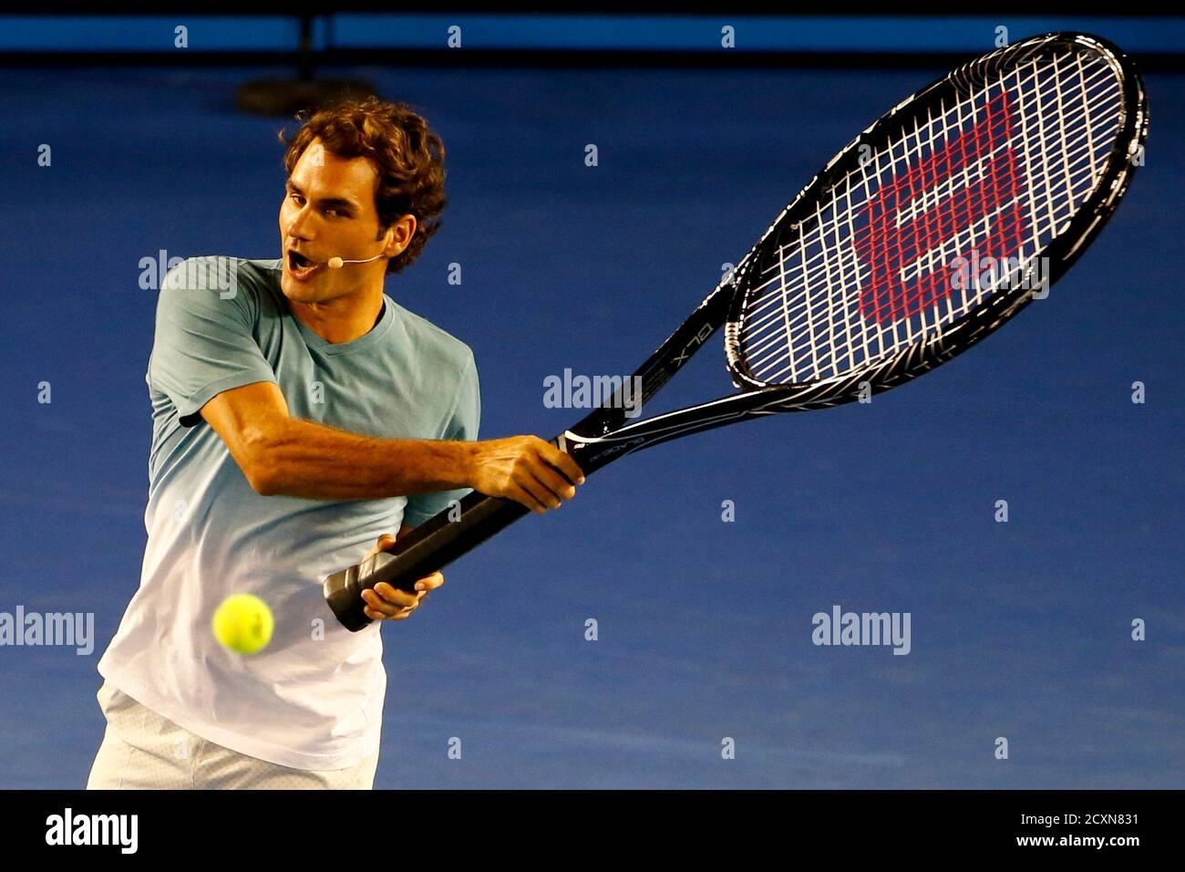 Roger Federer Of Switzerland Hits A Ball With An Oversized Tennis Racquet During The Kids Tennis Day Before The Australian Open 2014 Tennis Tournament In Melbourne January 11 2014 Reuters David Gray Australia