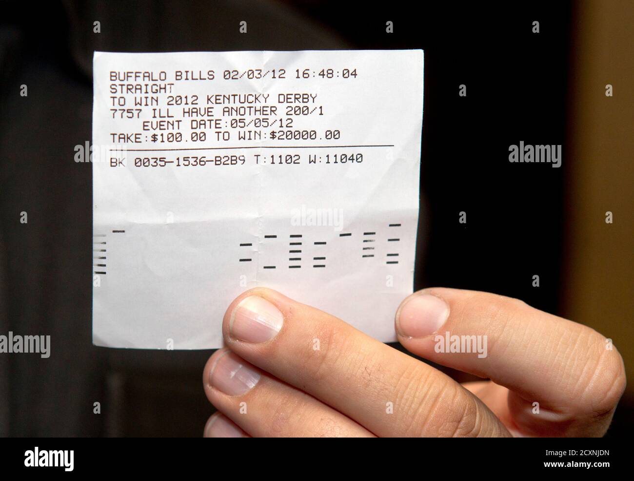 Doug O'Neill, trainer of Kentucky Derby winner 'I'll Have Another', displays his betting ticket before cashing the 200-to-1 future bet on the horse at the Primm Valley Casino in Primm, Nevada June 25, 2012. O'Neill won $20,000 for his $100 bet, which he made in February, that the horse would win the Kentucky Derby. REUTERS/Las Vegas Sun/Steve Marcus (UNITED STATES - Tags: SPORT HORSE RACING) Stock Photo
