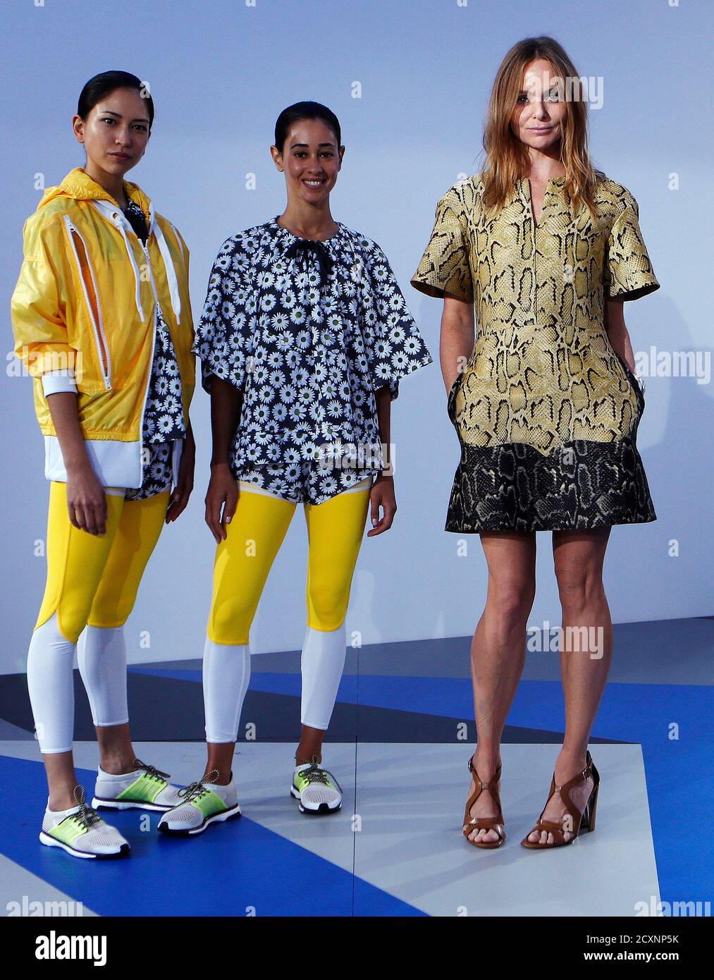 Designer Stella McCartney (R) poses with models wearing creations from the  Adidas by Stella McCartney Spring/