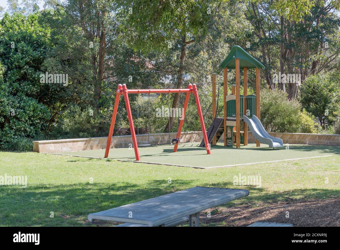A small park complete with children's swings and play area in the Sydney suburb of Annandale, New South Wales, Australia Stock Photo