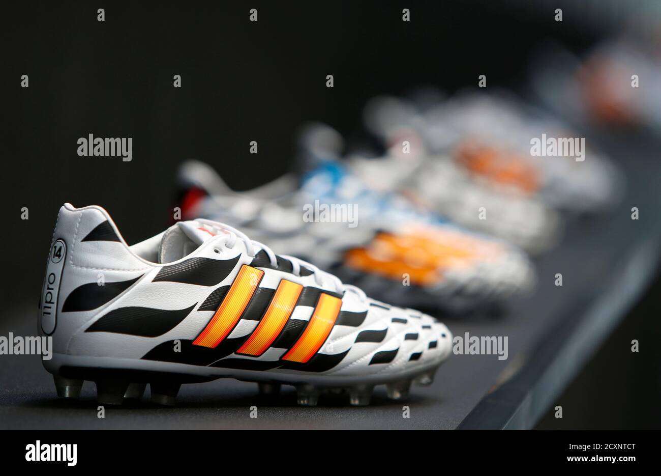 Adidas soccer shoes are pictured before the company's news conference in  the northern Bavarian town of Herzogenaurach, near Nuremberg June 24, 2014.  German sportswear firm Adidas expects to meet its target for