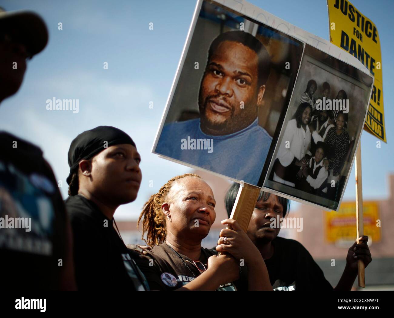 Delora McCoy (C), mother of Dante Parker, who died in San Bernardino Sheriff's custody, and his sisters Erica Fuller (L) and Makeba James march during the National Day of Protest to Stop Police Brutality in Los Angeles October 22, 2014. REUTERS/Lucy Nicholson (UNITED STATES - Tags: POLITICS CIVIL UNREST CRIME LAW) Stock Photo