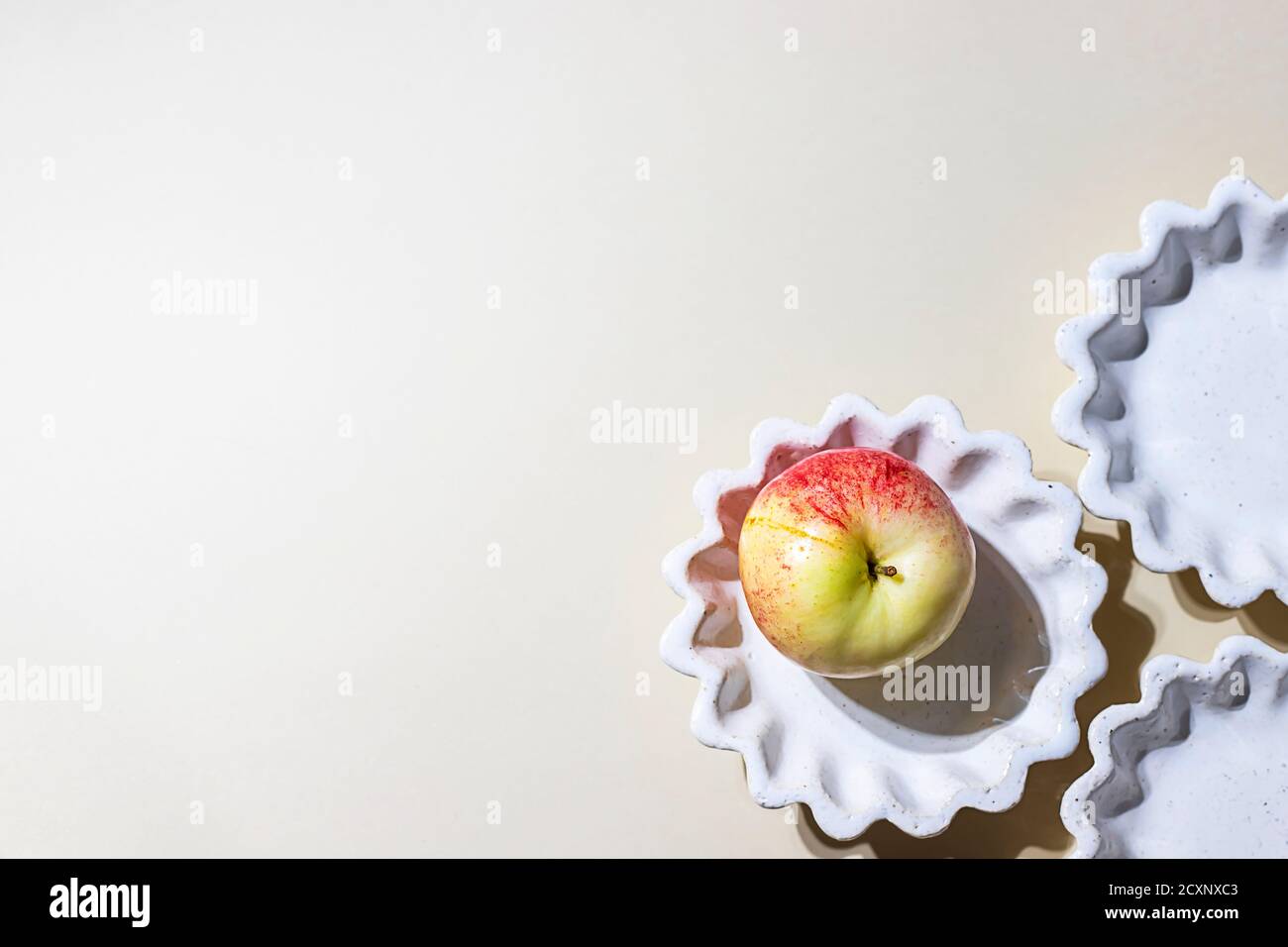 Ceramic handmade products. Concept homemade fall baking with apple. Stock Photo