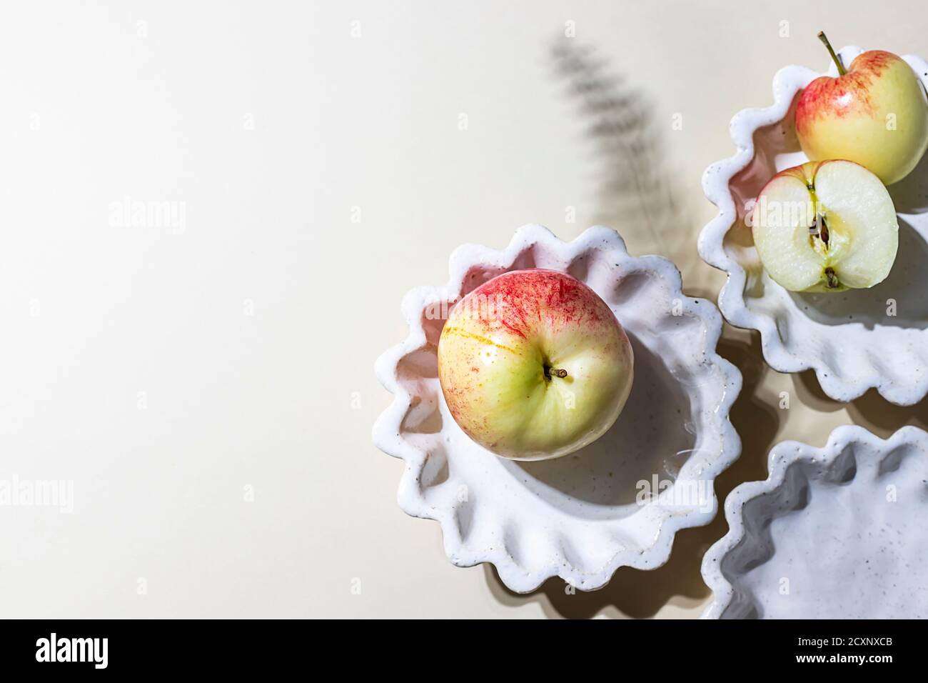 Ceramic handmade products. Concept homemade fall baking with apple. Stock Photo