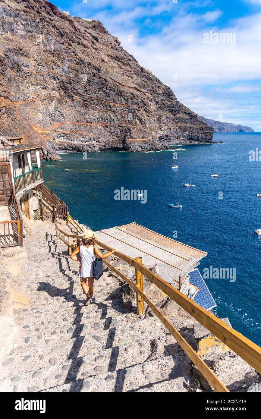 Young tourist descending the stairs in Puerto de Puntagorda in Canary Islands, Spain Stock Photo