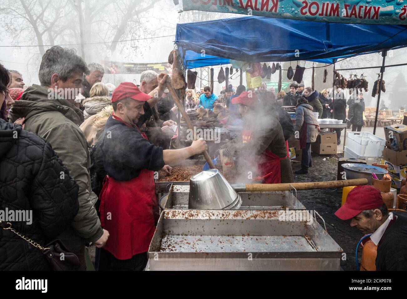 KACAREVO SERBIA FEBRUARY 18 2017 Man cooking cvarci in a pot