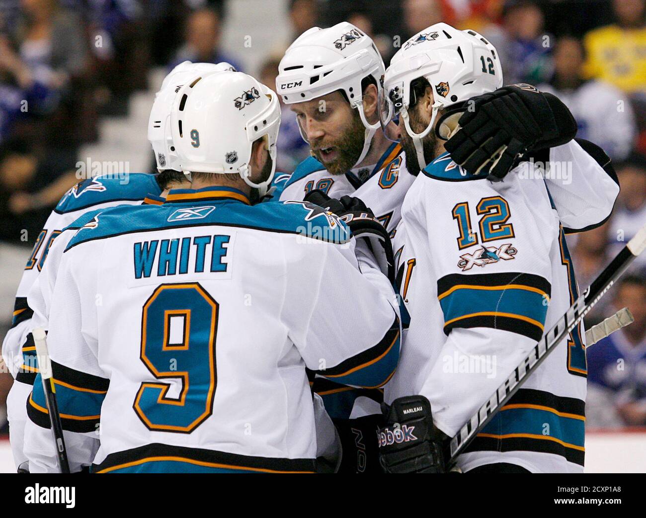 San Jose Sharks Joe Thornton C Congratulates Teammate Patrick Marleau 12 After Marleau S Goal On The Vancouver Canucks During The Second Period In Game 1 Of Their Nhl Western Conference Final Hockey