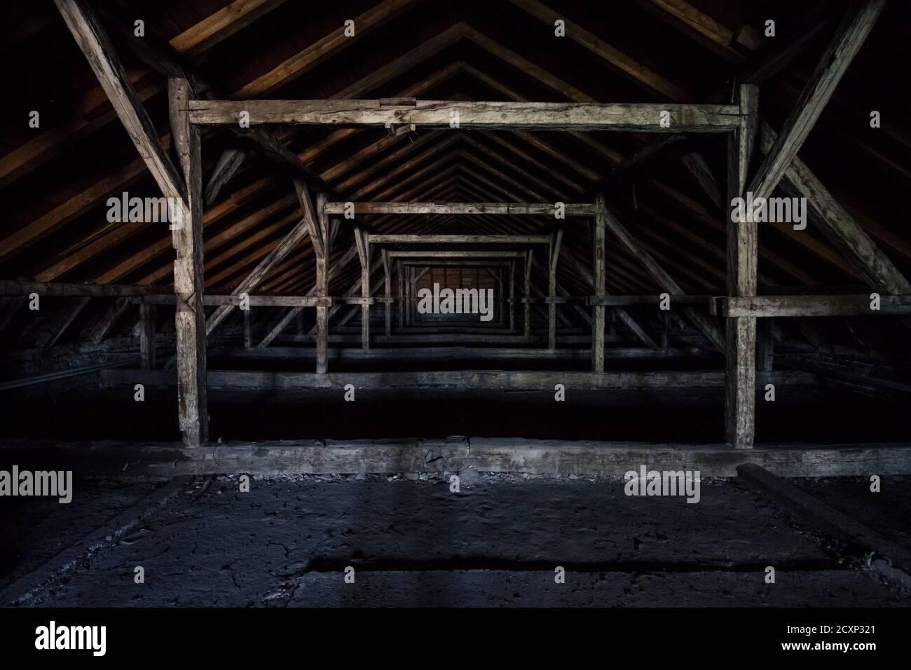 Picture of an old dark and abandoned attic of a residential building