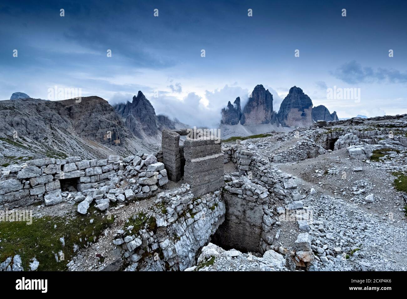 The 'Kuppe Est' stronghold of the Great War. In the background the Tre Cime di Lavaredo. Sesto Dolomites, Bolzano province, Italy. Stock Photo