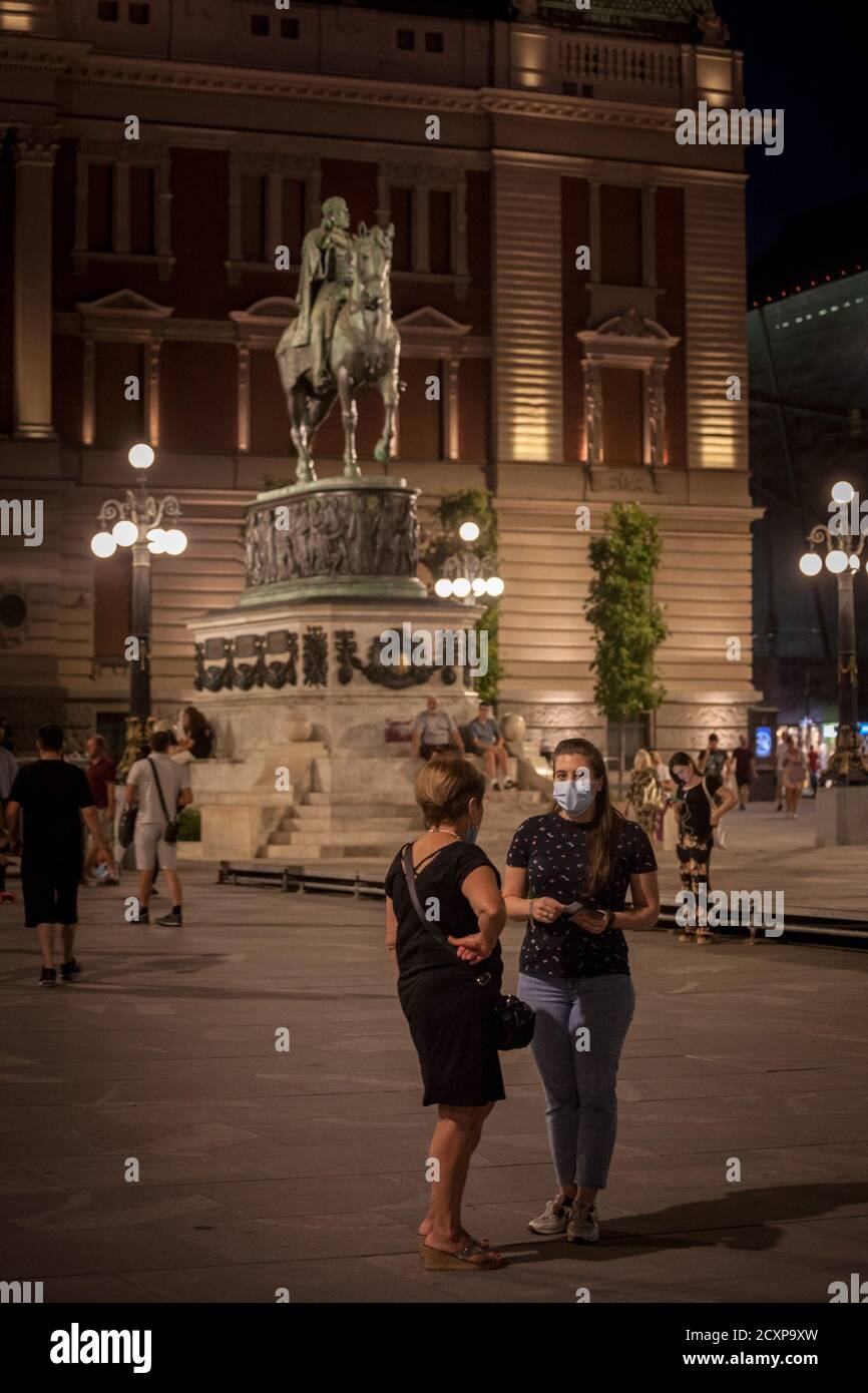 BELGRADE, SERBIA - SEPTEMBER 15, 2020: two female Women, stading in Trg Republike square in a place called kod konja wearing face mask respiration pro Stock Photo
