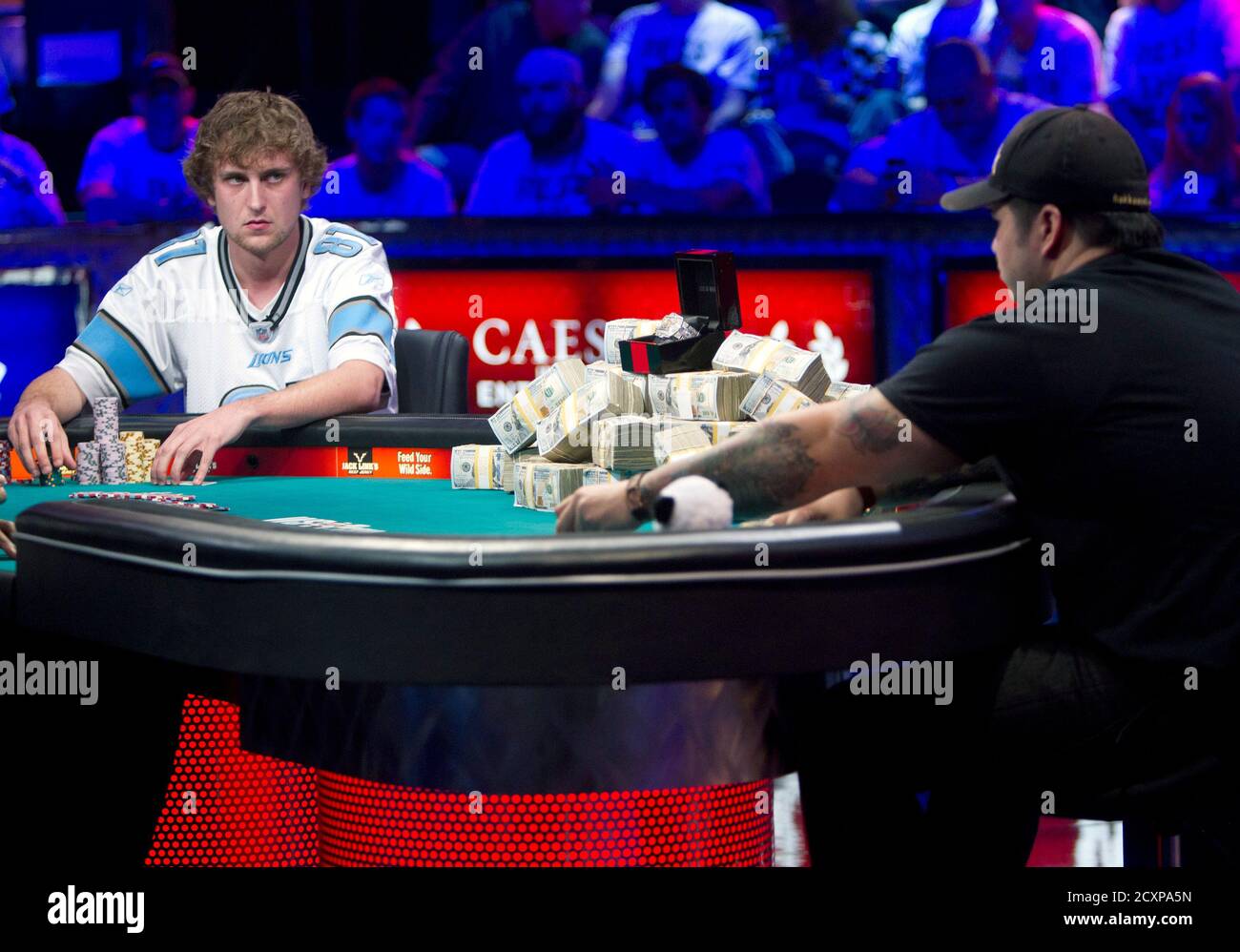 Ryan Riess (L), 23, a poker professional from East Lansing, Michigan contemplates a move against Jay Farber, 29, a Las Vegas VIP Host originally from Santa Barbara, California, during the final table of the World Series of Poker $10,000 buy-in no-limit Texas Hold 'Em tournament at the Rio Hotel & Casino in Las Vegas, Nevada November 5, 2013. REUTERS/Steve Marcus (UNITED STATES - Tags: SOCIETY TPX IMAGES OF THE DAY) Stock Photo