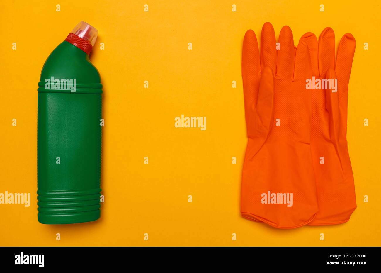 green toilet bottle and orange rubber gloves Stock Photo Alamy