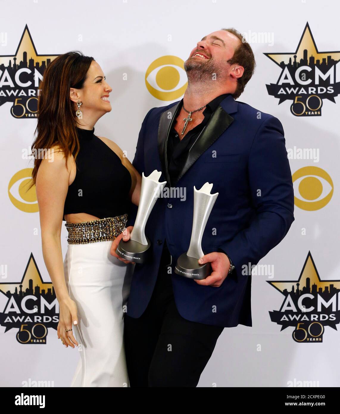 Singer Lee Brice and his wife, Sara Reeveley, pose with his Single of the  Year Award for 