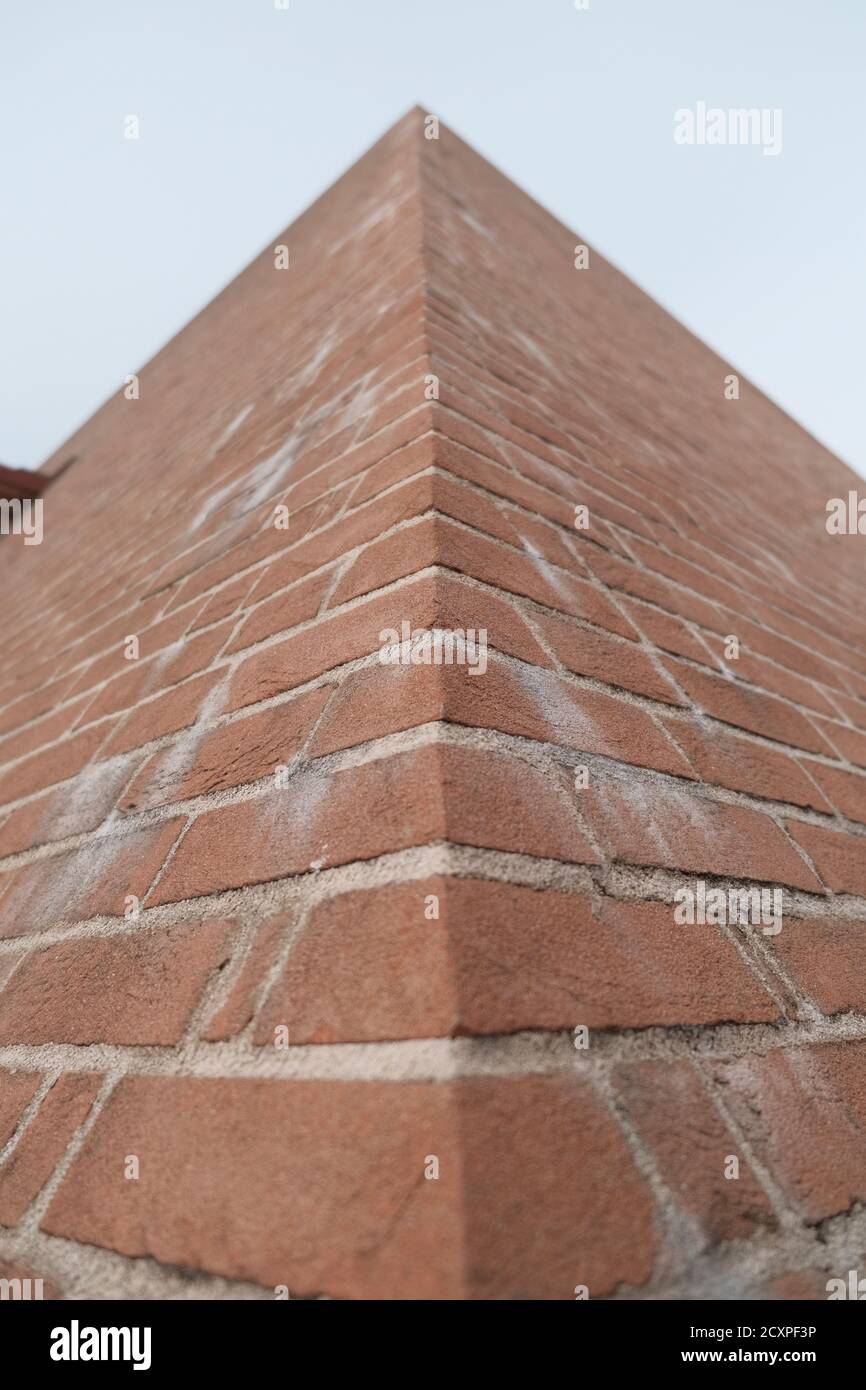red brick pyramid edge viewed from below. High quality photo Stock Photo