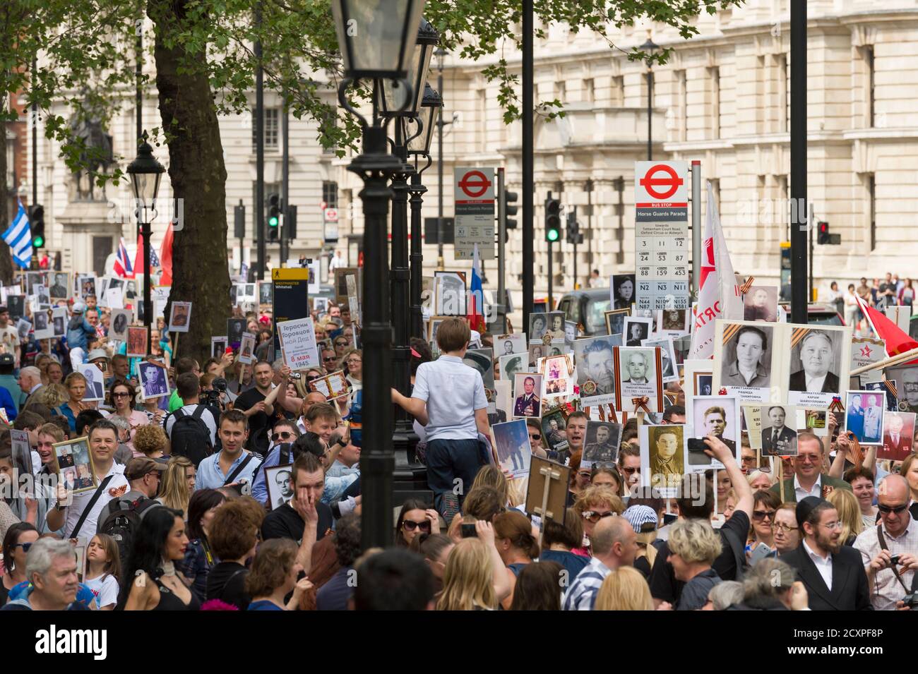 The London March of Immortal Regiment, the march is to commemorate Russian men and women who fought in WWII and are held across Russia and other countries on May 9th as part of the Victory Day celebrations. During the marches, people carry photographs of their relatives who participated in the war. Some 12 million people participated in the Immortal Regiment marches throughout Russia in 2015.  The London march started from the North Terrace of Trafalgar Square, just outside The National Gallery, the 'regiment' then walk to College Green via Whitehall, Downing Street, Parliament Square and West Stock Photo