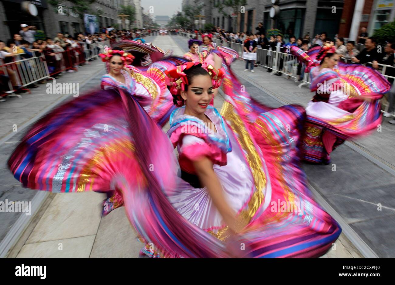 Performers from Mexico dance during the opening ceremony of 12th Beijing International Tourism Festival along Qianmen Commercial Street, in Beijing, September 19, 2010. REUTERS/Jason Lee (CHINA - Tags: TRAVEL) Stock Photo