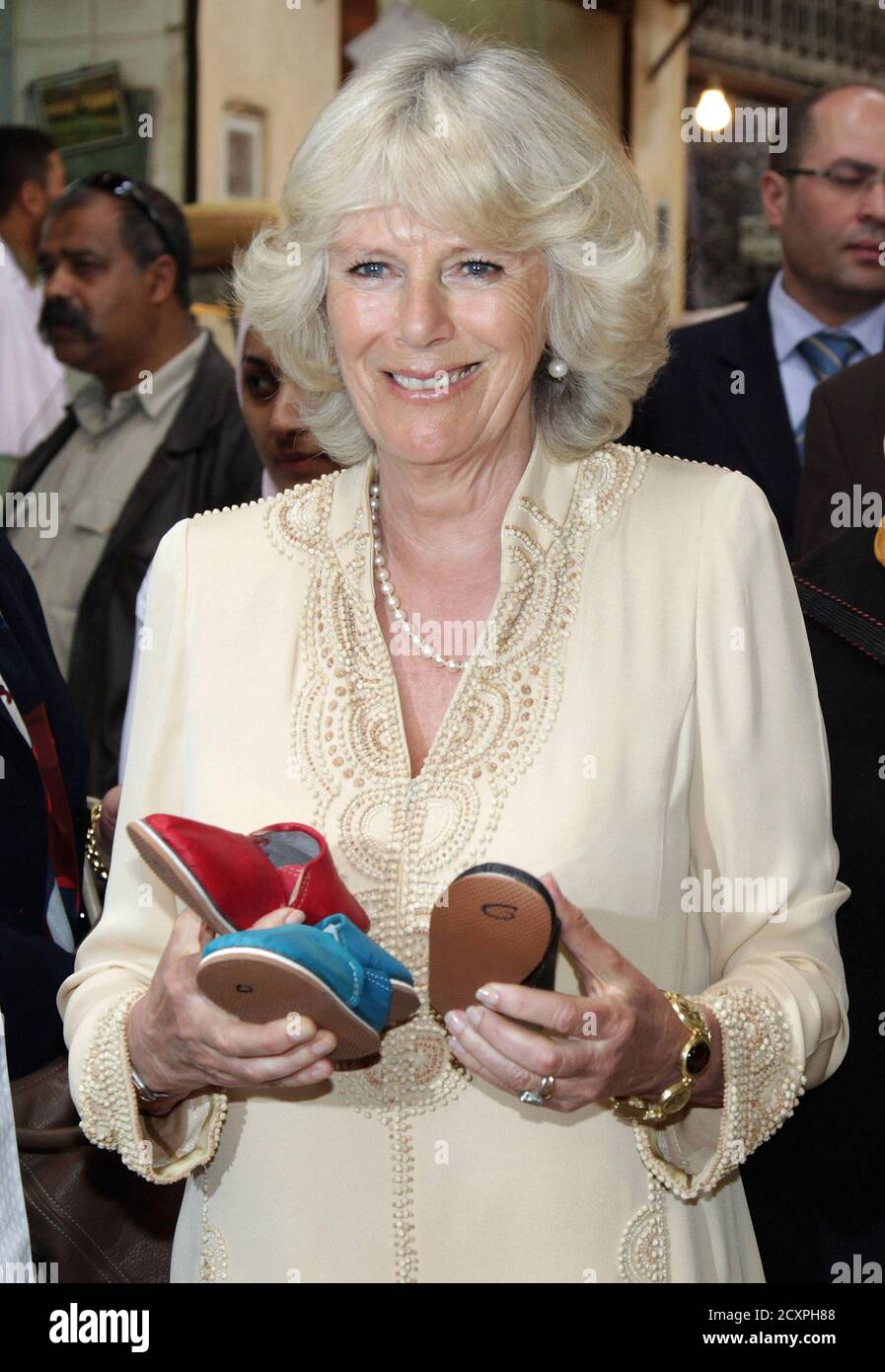 camilla-duchess-of-cornwall-visits-a-traditional-shoe-shop-in-the-medina-of-fez-morocco-april-6-2011-camilla-duchess-of-cornwall-and-her-husband-prince-charles-are-on-the-third-day-of-a-three-day-trip-to-morocco-as-part-of-a-tour-to-portugal-spain-and-morroco-the-prince-was-due-to-visit-an-area-of-the-sahara-desert-today-but-the-trip-was-cancelled-due-to-high-winds-reuterschris-jacksonpool-morocco-tags-royals-entertainment-travel-2CXPH88.jpg