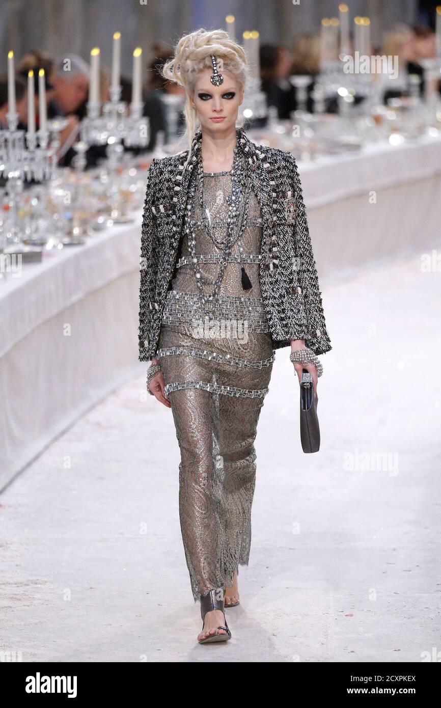 A model presents a creation with a Bombay-Paris theme by designer Karl  Lagerfeld during the Metiers D'Art Show for Chanel fashion house in Paris  December 6, 2011. The show, which exists since