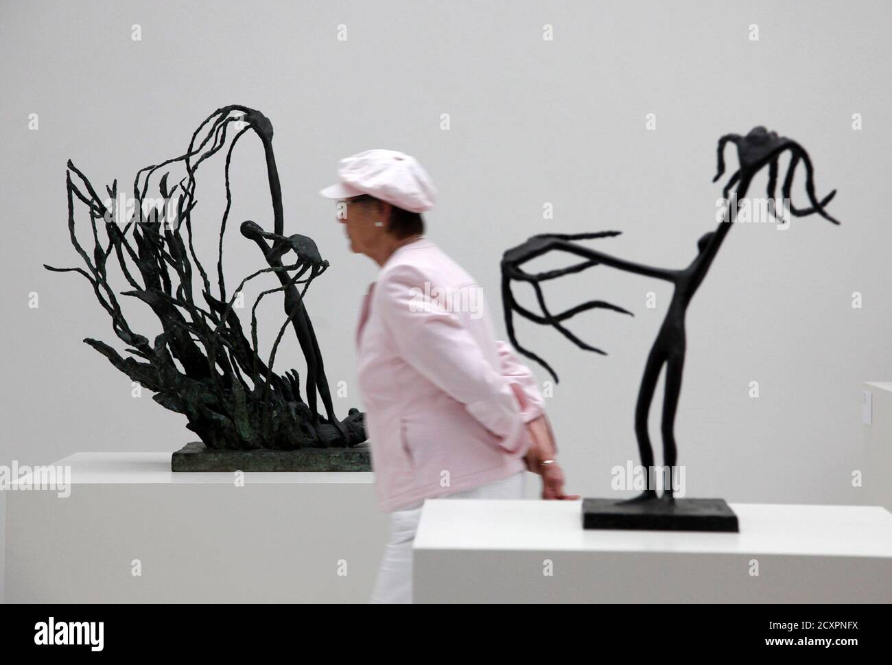 A Visitor Walks Past Art Works Prometheus Ii L And Prometheus R By Maria Martins During The Documenta 13 Art Exhibition In Kassel June 9 2012 The Show Which Was First Held