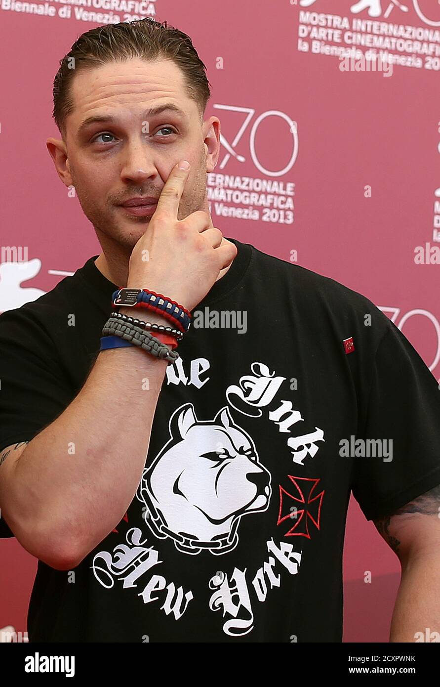 Cast member Tom Hardy scratches his face during a photocall for the movie 'Locke', directed by Steven Knight, during the 70th Venice Film Festival in Venice September 2, 2013. REUTERS/Alessandro Bianchi (ITALY - Tags: ENTERTAINMENT) Stock Photo