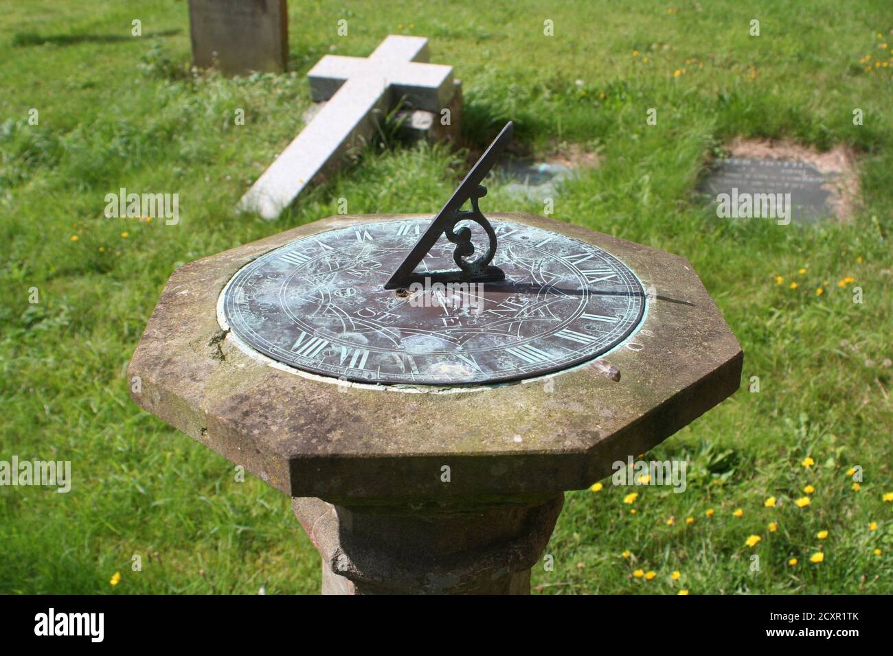 Sundial amongst the graves in a Yorkshire churchyard Stock Photo