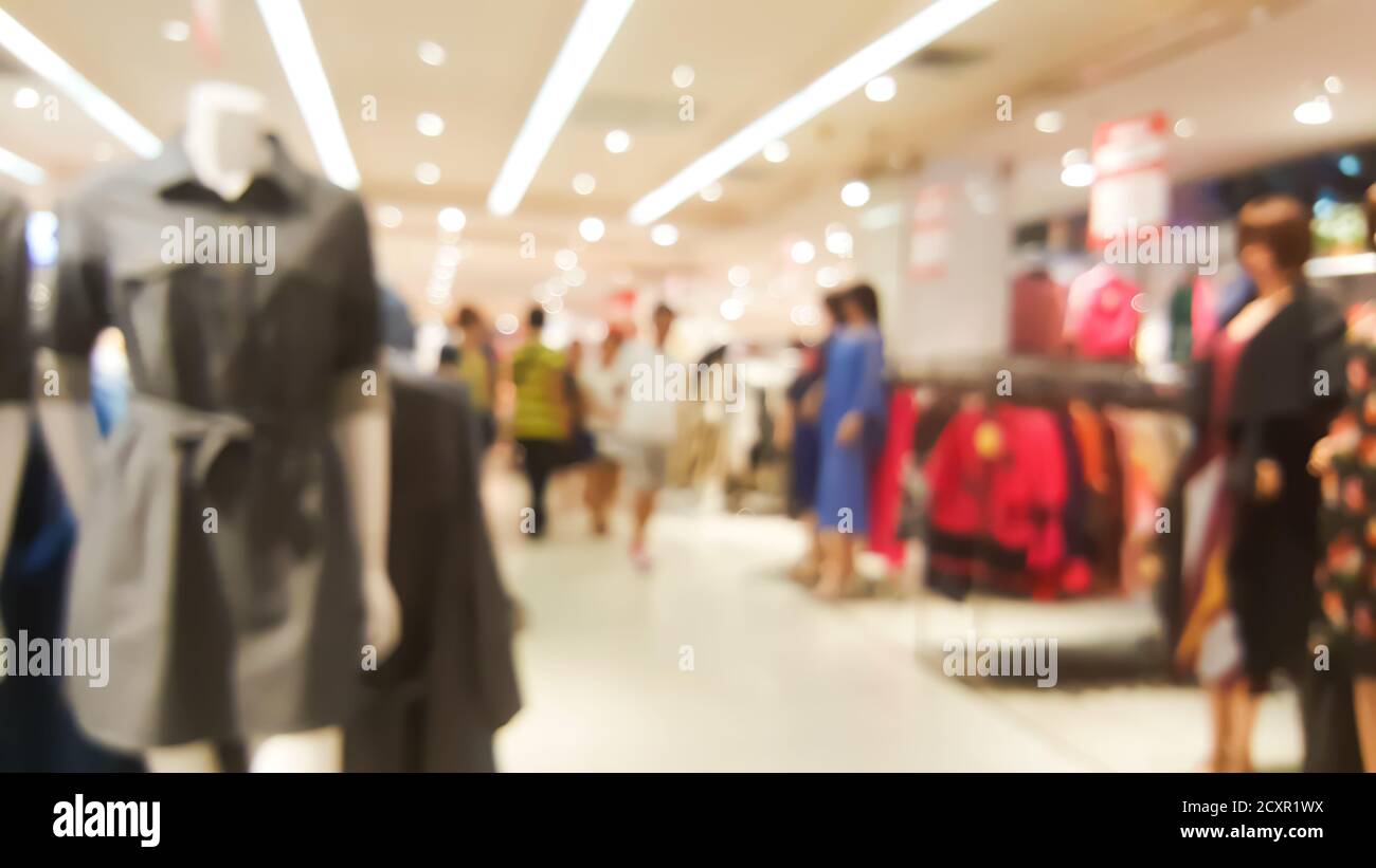 Blurred background of shopping mall in women clothes and fashion zone Stock Photo