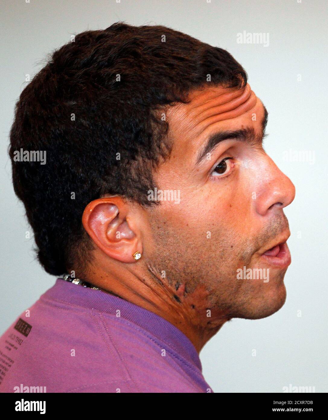 Argentine Soccer Player Carlos Tevez Arrives At Ezeiza Airport To Board A Plane To Paris On The Outskirts Of Buenos Aires February 13 2012 Tevez Who Has Been In Argentina On Unauthorised
