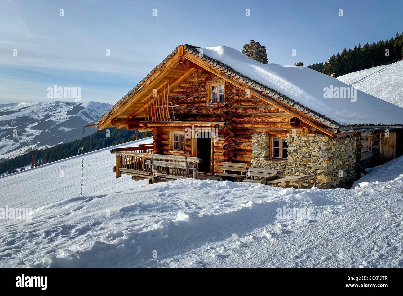 Snow covered mountain hut old farmhouse in the ski region of Saalbach Hinterglemm in the Austrian alps Stock Photo