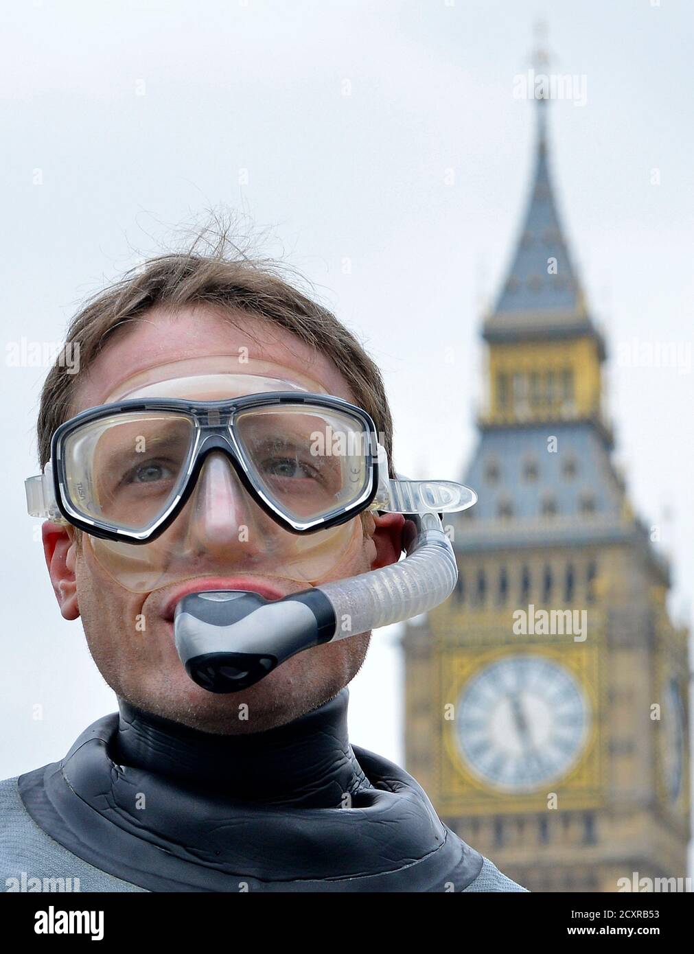 A demonstrator wears a mask and snorkel during a protest by environmental campaigners calling on the government to provide more Marine Conservation Zones (MCZs) in British waters, London February 25, 2013.  REUTERS/Toby Melville (BRITAIN - Tags: POLITICS ENVIRONMENT MARITIME) Stock Photo