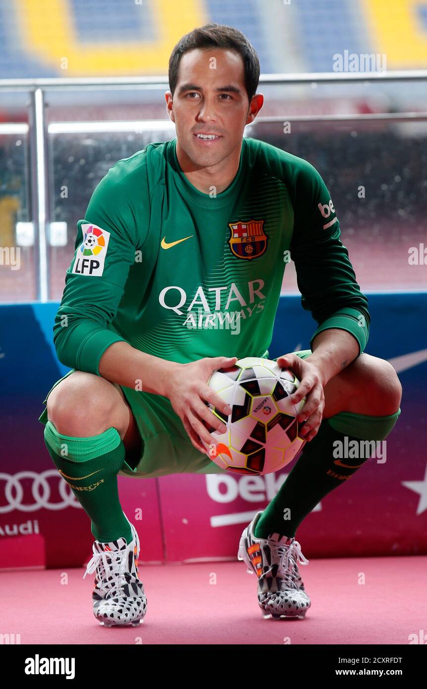 FC Barcelona's newly signed goalkeeper Claudio Bravo from Chile poses  wearing his new jersey during his