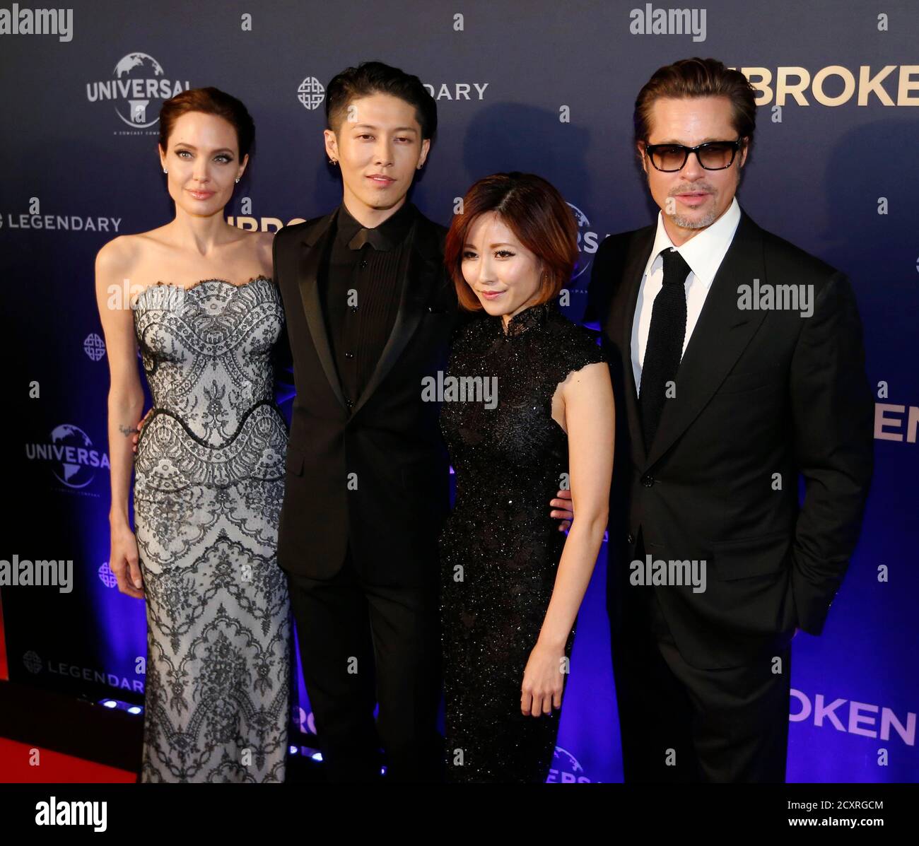 L R Angelina Jolie Cast Member Miyavi His Wife Melody Ishihara And Brad Pitt Pose At The World Premiere Of Jolie S Film Unbroken At The State Theatre In Sydney November 17 2014 The