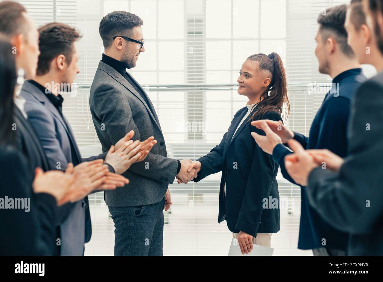 Happy employees clapping boss hi-res stock photography and images - Alamy