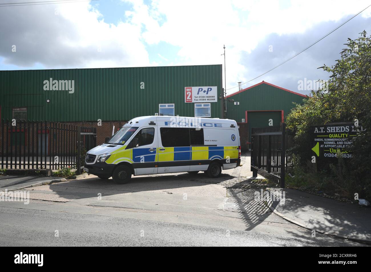 A Police Vehicle Blocking An Entrance To Albion Works Industrial Estate In Brierley Hill West Midlands In The Area Where Two Men Were Found Shot Dead In A Car On Wednesday Afternoon