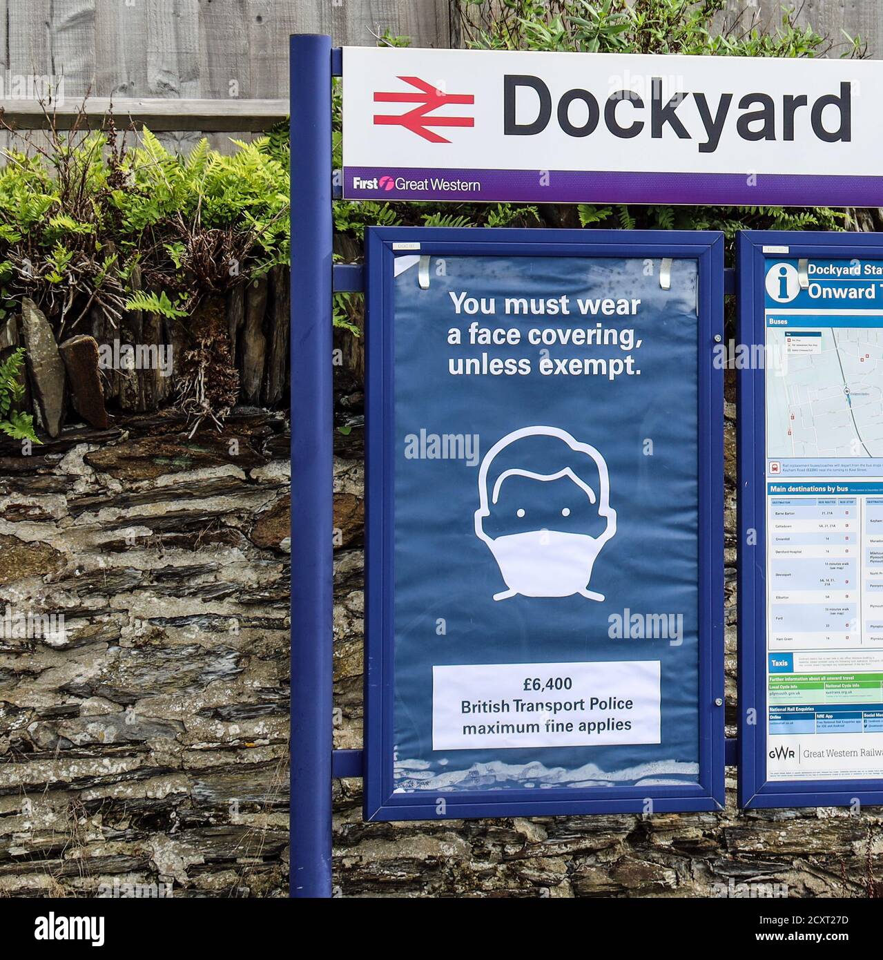 A strong warning of a fine up to £6,400 for not wearing a facemask on theb little Dockyard Halt station platform in the Plymouth suburb of Devonport Stock Photo