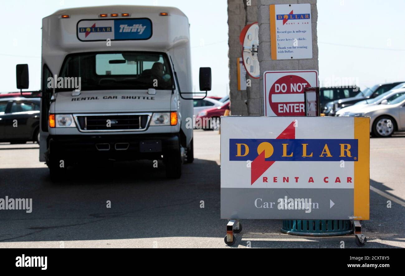 A Dollar Thrifty rental car shuttle bus waits to transport customers from a  rental lot near Detroit Metropolitan airport in Romulus, Michigan, May 9,  2011. Hertz Global Holdings Inc fired the latest