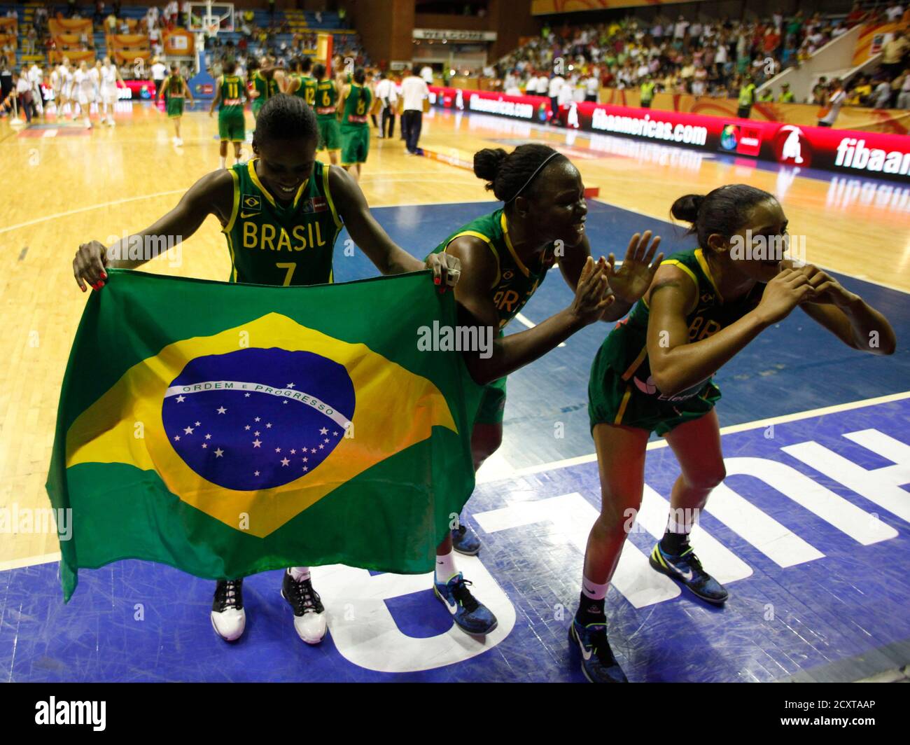 Brazil's team celebrates after defeating Argentina in the final round of the FIBA Americas Championship for Women in Neiva October 1, 2011. REUTERS/John Vizcaino (COLOMBIA - Tags: SPORT BASKETBALL) Stock Photo