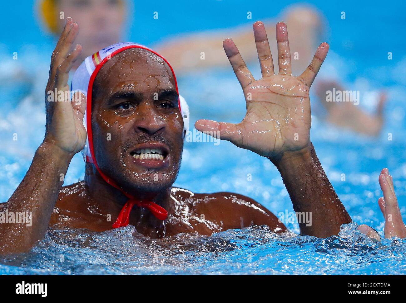 Spain's Ivan Perez Varga reacts during their men's preliminary round Group  A water polo match against Australia at the London 2012 Olympic Games at  the Water Polo Arena August 2, 2012. REUTERS/Laszlo
