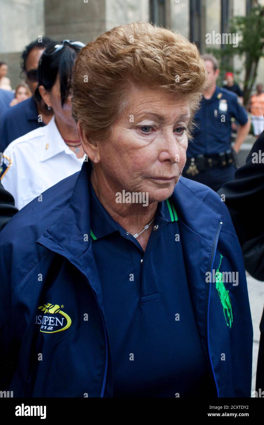 Lois Ann Goodman, 70, is led away from the Manhattan Criminal Court after  being extradited to California in the custody of Los Angeles Police  Department detectives in New York, August 23, 2012.