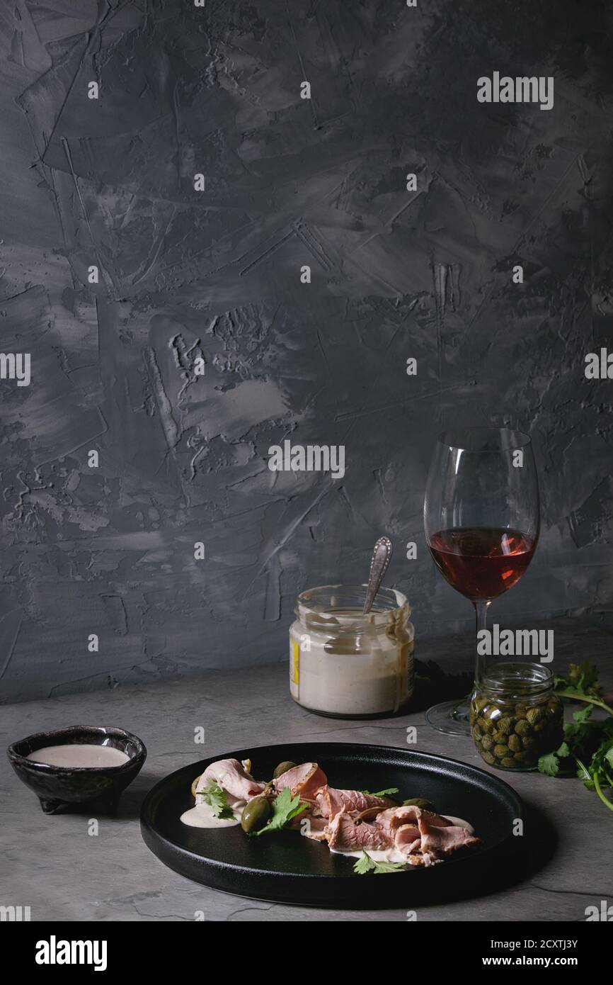 Vitello tonnato italian dish. Thin sliced veal with tuna sauce, capers