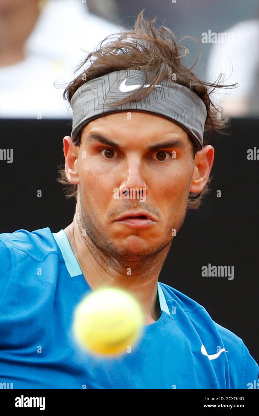 Rafael Nadal of Spain eyes the ball as he hits a return to Novak Djokovic of Serbia during their men's singles final match at the Rome Masters tennis tournament May 18, 2014. Rafael Nadal of Spain eyes the ball as he hits a return to Novak Djokovic of Serbia during their men's singles final match at the Rome Masters tennis tournament May 18, 2014.