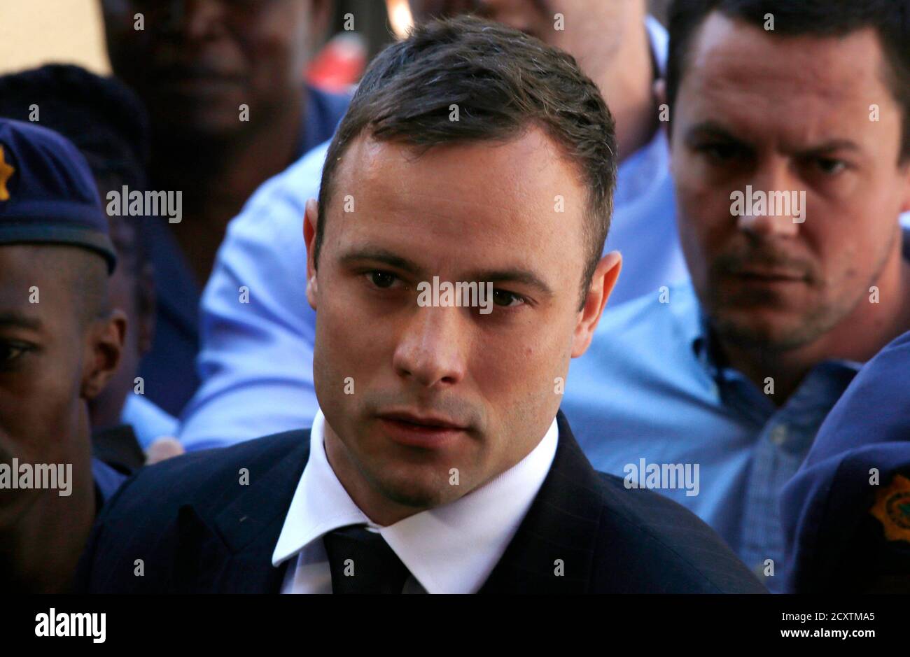 South African Olympic and Paralympic sprinter Oscar Pistorius arrives at the North Gauteng High Court in Pretoria October 21, 2014. Pistorius arrived at the court on Tuesday to be sentenced for killing his girlfriend, Reeva Steenkamp, closing one of the most sensational trials in South African history and one that may yet fuel controversy about race and money in its justice system. REUTERS/Mike Hutchings (SOUTH AFRICA - Tags: SPORT CRIME LAW ATHLETICS HEADSHOT) Stock Photo
