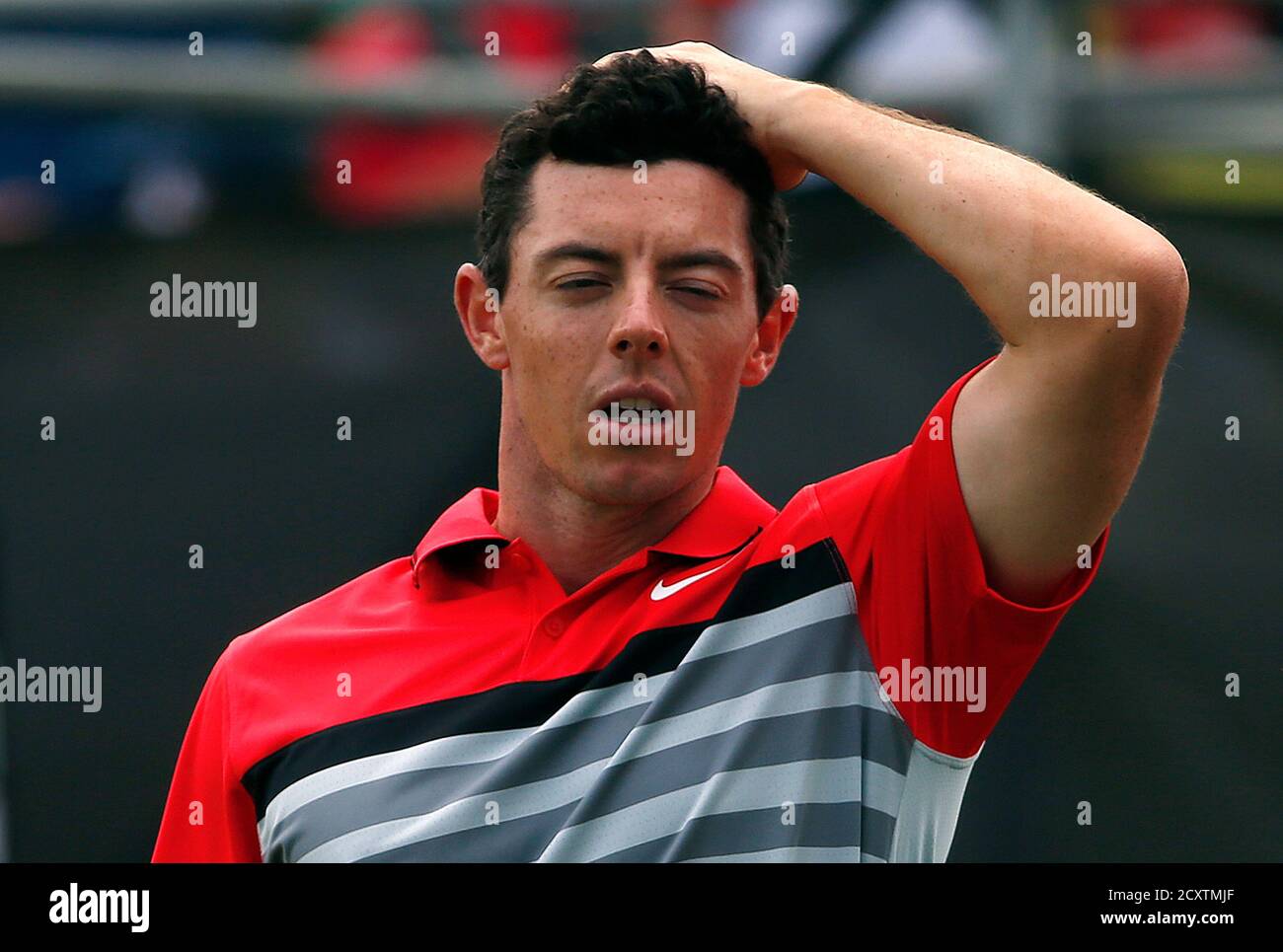 World number one and defending champion Rory McIlroy of Northern Ireland reacts after finishing his fourth and final round of the Australian Open golf tournament at The Australian Golf Club in Sydney November 30, 2014.    REUTERS/David Gray      (AUSTRALIA - Tags: SPORT GOLF) Stock Photo